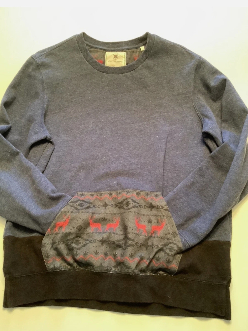 on the byas Men's Heathered Navy Crewneck Sweater with Red Accent